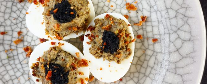 Eggs three ways. Crispy bacon and smoked eggplant stuffed eggs topped with caviar.